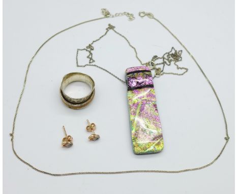 A silver designer ring, a silver chain, a pair of silver and stone set earrings and a pendant and chain 