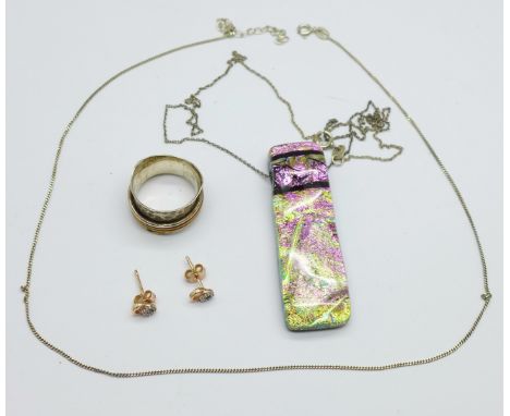 A silver designer ring, a silver chain, a pair of silver and stone set earrings and a pendant and chain 