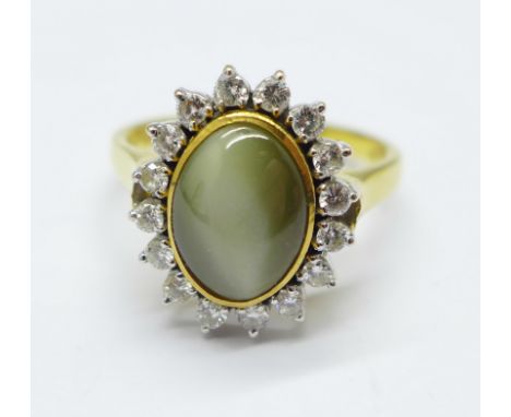 An 18ct gold, 'cats eye' and diamond cluster ring, 5.9g, Q 