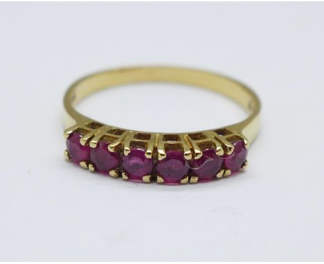 A 14ct gold, six stone ruby ring, 1.9g, N 