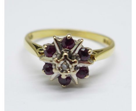 An 18ct gold, ruby and diamond cluster ring, 2.7g, M 