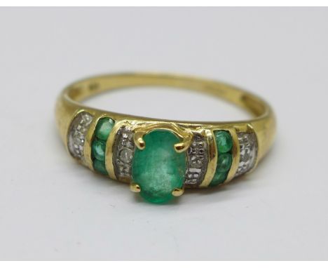 A 9ct gold, diamond and emerald ring, 1.6g, O 