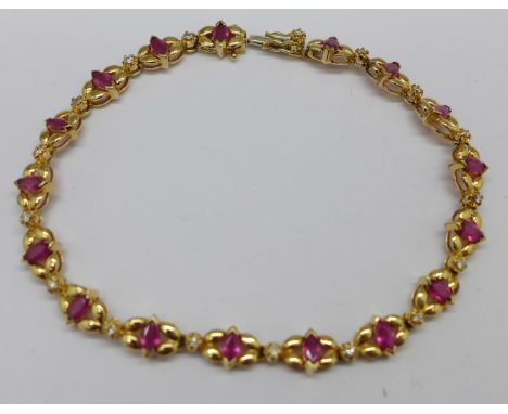 A 14k gold, ruby and diamond bracelet, 8.9g 