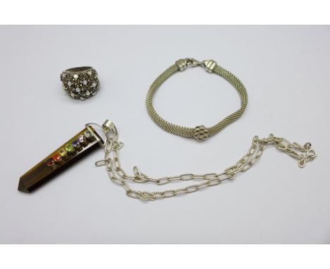 A large silver, tigers eye and gem set pendant and chain, a silver gem set ring and a silver bracelet 