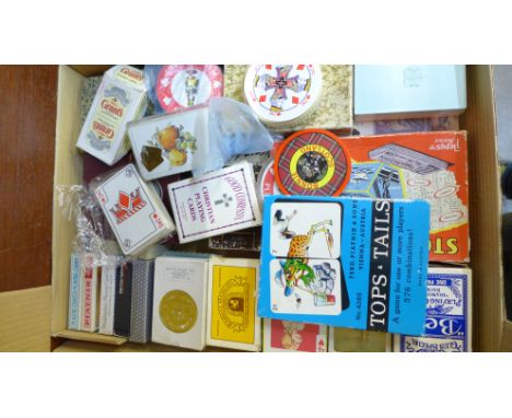 A collection of playing cards including shaped and advertising 