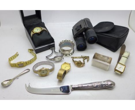 Lady's wristwatches, a silver napkin ring, a silver handled cheese knife, a pair of field glasses, etc. 