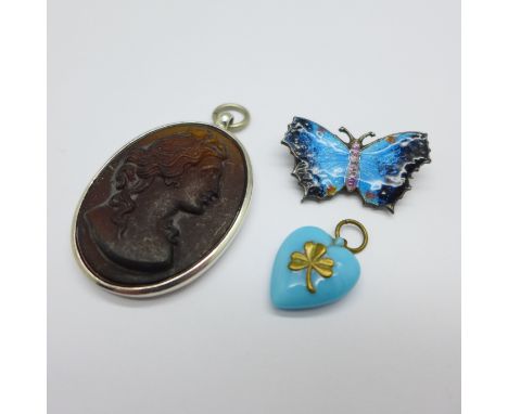 An enamel butterfly brooch, a silver pendant and a turquoise coloured heart pendant 