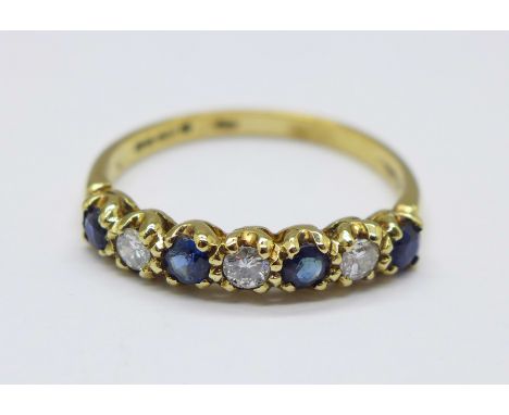 An 18ct gold, seven stone sapphire and diamond ring, 2.6g, Q 