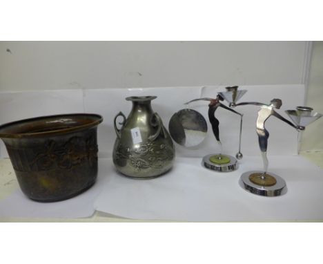 A pewter Arts and Crafts jug with three handles, a/f, a jardiniere, and two Art Deco chrome figures, gong and candlestick, (4
