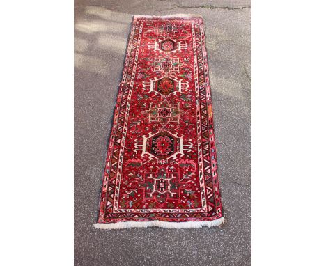 A handmade wool runner, 212cm x 70cm