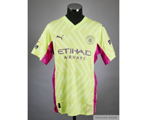 Ederson yellow and pink No.31 Manchester City match worn short-sleeved shirt, Puma, XL with v-neck collar and printed badge, 