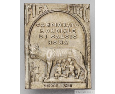 Rare white-metal FIFA 1934 World Cup official's badge depicting Romulus and Remus and inscribed FIFA FIGC, CAMPIONATO MONDIAL