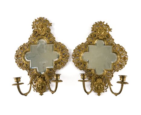 A PAIR OF LOUIS XIV REVIVAL GILT-METAL TWIN LIGHT GIRANDOLE (2)Early 20th Century 
Of cartouche outline, bevelled mirror plat