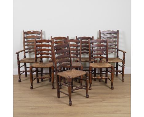 A SET OF EIGHT 19TH CENTURY OAK AND ASH LADDER BACK CHAIRS (8)To include a pair of carvers, 56cm wide; 106cm high
