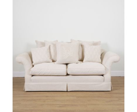 A MODERN THREE SEAT SOFAWith shaped back and outswept arms, 230cm wide; 84cm high