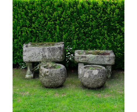 A CARVED STONE RECTANGULAR TROUGH (4)On associated reconstituted stone stands, 76cm wide; 50cm deep; 63cm high, together with