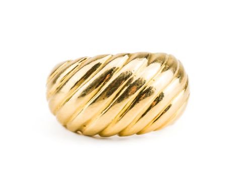 A GOLD RINGIn a ridged bombe design, ring size G, weight 7.4 gramsCONDITION REPORTRing is stamped '18K' to the inside of the 