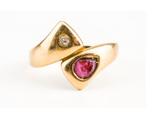 A GOLD, RUBY AND DIAMOND RINGMounted with a pear shaped ruby and with a single cut diamond in a twistover design, detailed 75