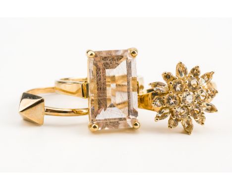 A 9CT GOLD RING AND TWO FURTHER RINGS (3)The first ring with a pyramid motif, ring size O and two further 9ct gold and gem se