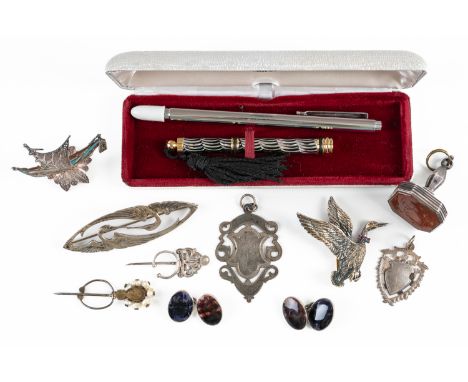 A CORNELIAN FOB SEAL AND FURTHER ITEMSThe seal character engraved, also a filigree model of a small ship, two fob medals, a p