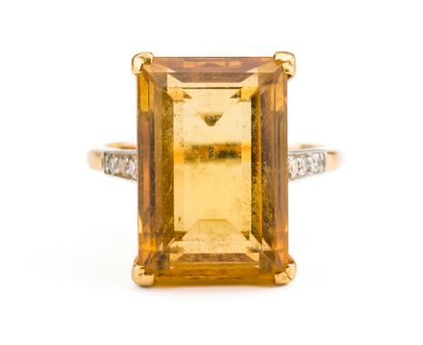 A CITRINE AND DIAMOND RINGClaw set with a rectangular step cut citrine measuring 16.8mm x 11.3mm, with diamond set three ston