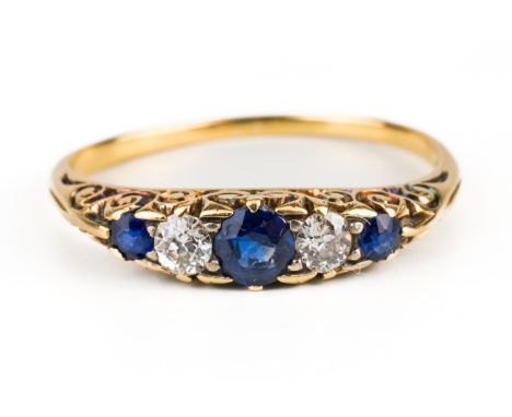 A GOLD, SAPPHIRE AND DIAMOND FIVE STONE RINGMounted with three cushion shaped sapphires alternating with two cushion shaped d