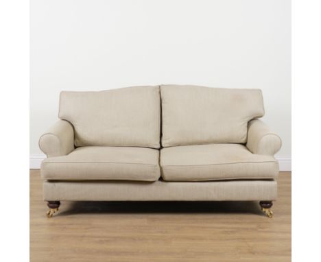WESLEY-BARRELL; A BEIGE UPHOLSTERED THREE SEAT SOFA180cm wide; 88cm high