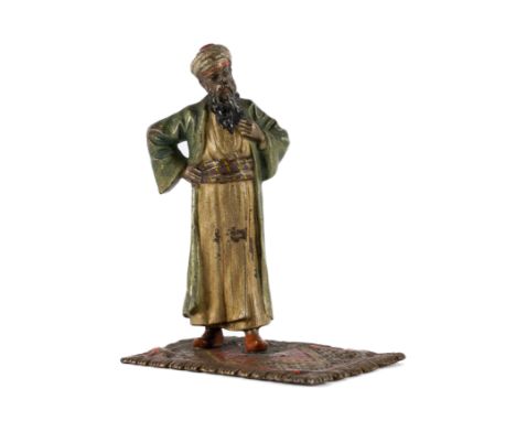 PROBABLY FRANZ XAVER BERGMANN, AN EARLY 20TH CENTURY COLD PAINTED BRONZE FIGURE OF A MAN STANDING ON A CARPET8cm highThere is