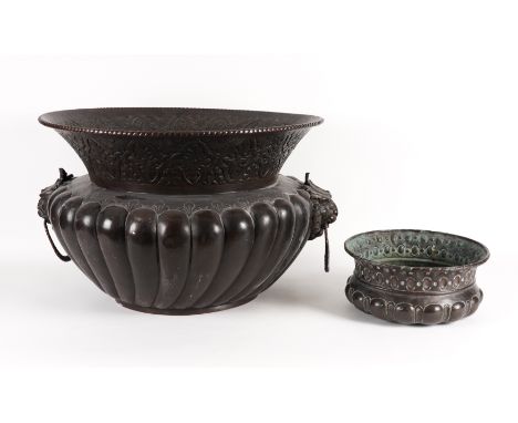 AN ITALIAN 17TH CENTURY STYLE BRONZE PATINATED COPPER CISTERN (2)19th Century 
With lion mask ring pull handles, flared embos
