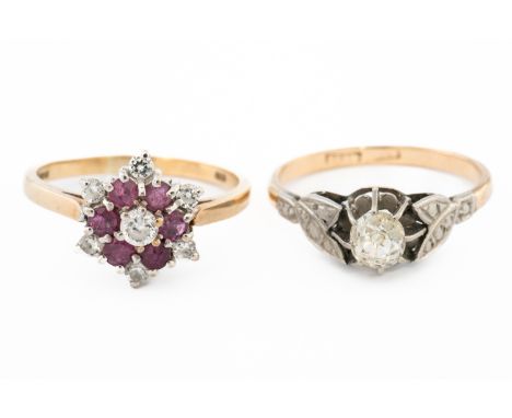 A GOLD AND PLATINUM DIAMOND SINGLE STONE RING AND ANOTHER RING (2)The first ring claw set with a cushion shaped diamond betwe