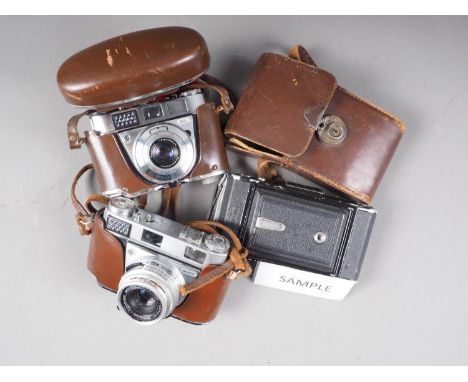 A Kodak Retina IIIS camera and lens, in leather travel case, a&nbsp;Zeiss Ikon, a Kodak Retinette IB (damaged), a Kodak Regul