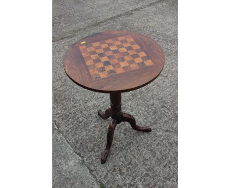 A 19th century rosewood and satinwood games table, on turned column and carved tripod splay supports, 19" dia x 27" high 