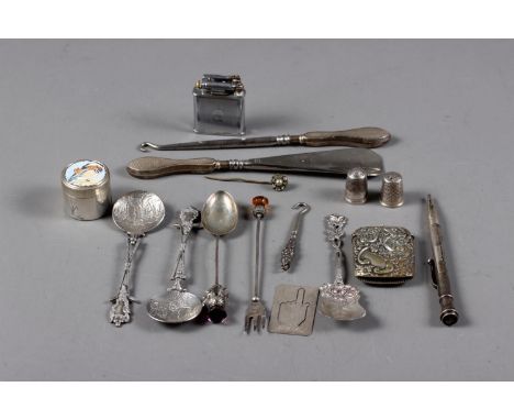 A group of silver and white metal items, including spoons, thimbles, manicure implements, a Polo lift arm cigarette lighter, 