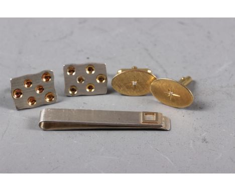 A pair of 14ct gold and diamond cufflinks, 11.1g, a pair of silver cufflinks and a silver tie clip 