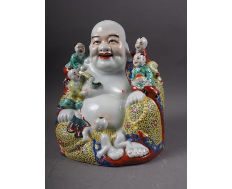 A Chinese figure of a Buddha and five followers, two seal marks to base, 10" highCondition:Tiny losses to decoration in the r