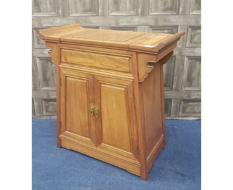 20TH CENTURY CHINESE HARDWOOD CHEST, the rectangular top with a hinged central panel and scroll ends, above a pair of cupboar