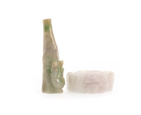 20TH CENTURY CHINESE JADE 'EMPEROR'S RING', 4.5cm diameter; along with a jade cigarette holder, 6.5cm long (2)