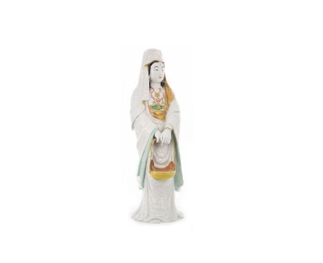 LATE 19TH/EARLY 20TH CENTURY CHINESE CERAMIC FIGURE OF GUANYIN, wearing a white robe with enamel relief designs, modelled sta