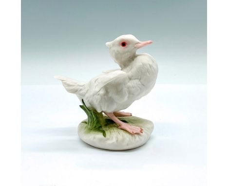 A figure of a small white fuck with wings spread out. This model is considered the first modern Cybis duck. Cybis marked on t
