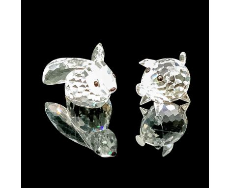 Faceted clear cut crystal, with black-colored beaded eyes. Swarovski backstamp. This item has its original box. Box measures 