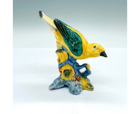 Part of the Stangl Pottery Birds collection. A model of a yellow bird with green wings. Stangl Pottery Birds 3447 marked on t