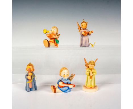 A set of 5 Goebel Hummel figures that depict a child angel that is playing an instrument in their hands. Goebel Hummel backst