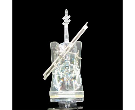 Instrument is clear crystal with rhodium stand and bow. Swarovski backstamp. 7477000002. This item has its original box: 6.5"