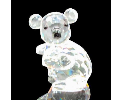 Part of the Endangered Species Collection. Clear, faceted left facing body with round ears, black eyes and nose. Swarovski ba