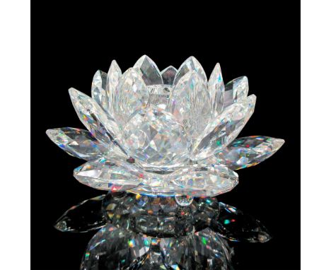 Beautiful crystal petals on round footed base. Swarovski backstamp. 7600 125 000. This item has its original box: 8.5"L x 8.5