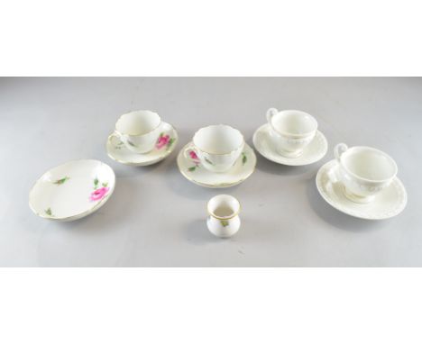 Meissen porcelain comprising, two white glazed cups and saucers with gilt banding, two cups and three saucers with floral dec