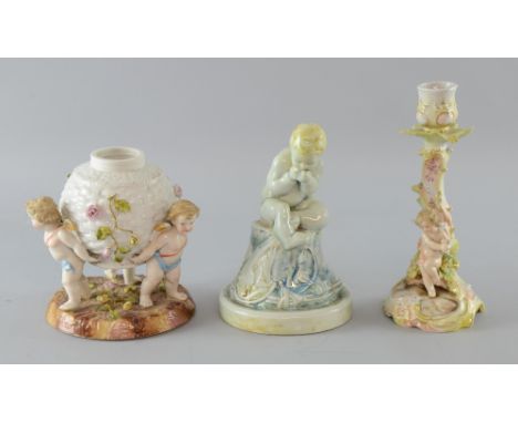 Late 19th Century Sitzendorf porcelain centrepiece decorated with cherubs, 16cm high and similar decorated candlestick, 22cm 