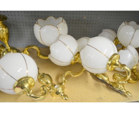 Brass and white glass five light chandelier, with matching three light chandelier and three sets of wall lights, 