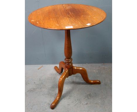 Oak circular table on turned column support to tripod base 