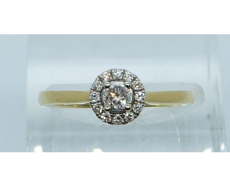 An 18ct white and yellow gold ring set with a diamond of approximately 0.14ct, with certificate&nbsp;